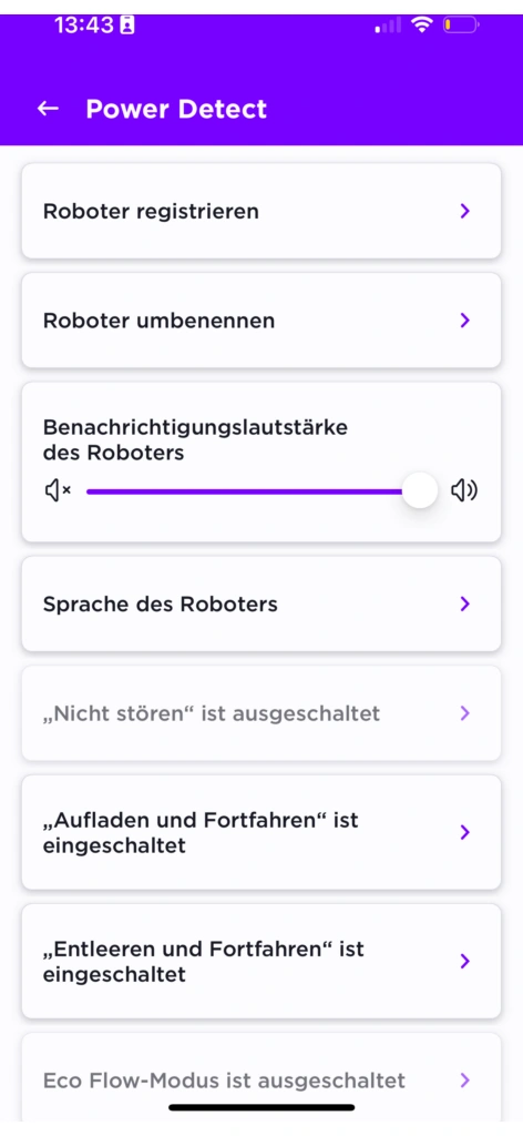 Screenshot der „Power Detect“-Einstellungen in der Shark Clean-App. Die Benutzeroberfläche ist in einem lila-weißen Design gehalten. Sichtbar sind verschiedene Steuerungsoptionen für den Saugroboter, darunter das Registrieren und Umbenennen des Geräts, die Anpassung der Benachrichtigungslautstärke sowie Einstellungen wie „Nicht stören“, „Aufladen und Fortfahren“ und „Entleeren und Fortfahren“.