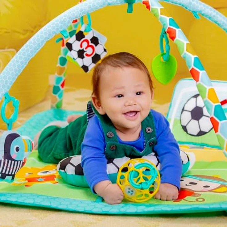 Bright Starts Grip & Kick Activity Gym, Spielbogen mit Licht- und Soundeffekt, abwaschbare Matte, 30 Melodien, für Neugeborene – Bild 8