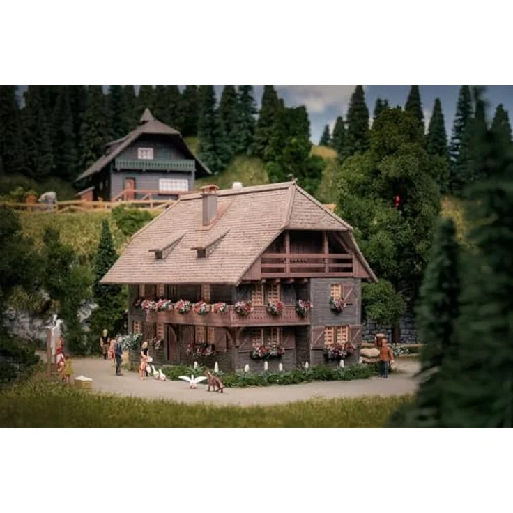 FALLER 130012 Jubiläumsmodell Uhrenmacherhaus mit Figur, Spurweite H0, Modelleisenbahn-Zubehör – Bild 1