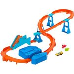 Hot Wheels Deluxe Streckenset JDB49, motorisierter Beschleuniger, 1:64 Maßstab, Track-Schnellstecksystem, individuelle Bauvarianten, Sprung-Strecke