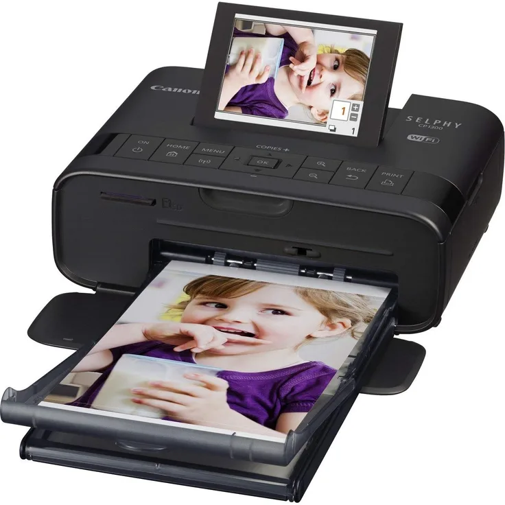 Canon Selphy CP1300 Fotodrucker 10x15cm (mobil Drucker, WLAN,USB,300x300dpi, Thermosublimation, optionaler Akku, Farbdisplay, Speicherkartenslot, Apple AirPrint, Passfoto- u. Postkartendruck) schwarz (2234C002)