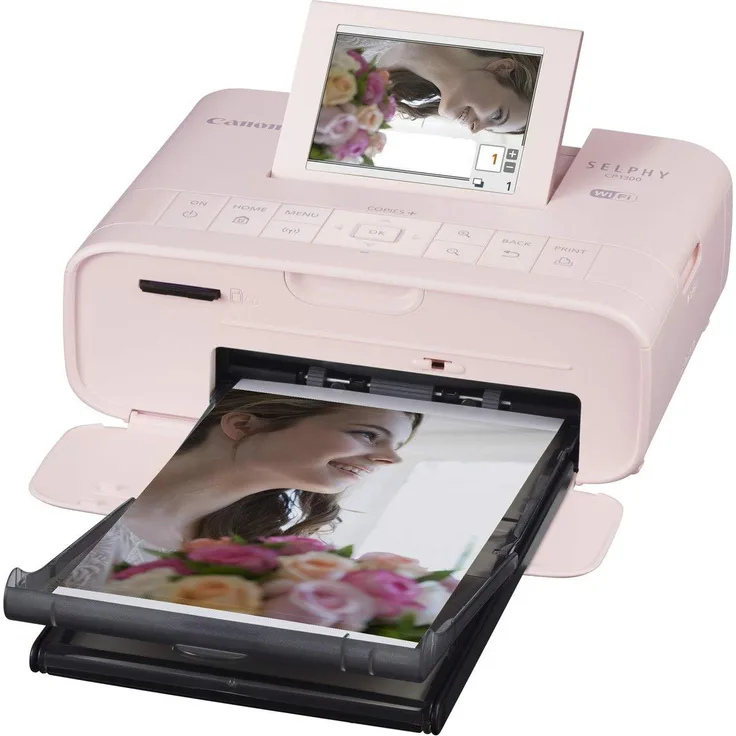 Canon Selphy CP1300 Fotodrucker 10x15cm (mobil Drucker, WLAN, USB, 300x300dpi, Thermosublimation, optionaler Akku, Farbdisplay, Speicherkartenslot, Apple AirPrint, Passfoto- u. Postkartendruck) rosa (2236C002)