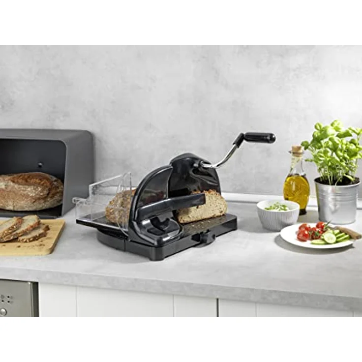 WENKO Brotschneidemaschine Schwarz, Schneidemaschine für Brot aus Kunststoff mit Edelstahlmesser, Führungsschlitten mit Restehalter und Fingerschutz, fester Stand durch Saugnapf, 31 x 20 x 29 cm – Bild 5